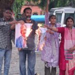 Cong burns posters over poll irregularities
